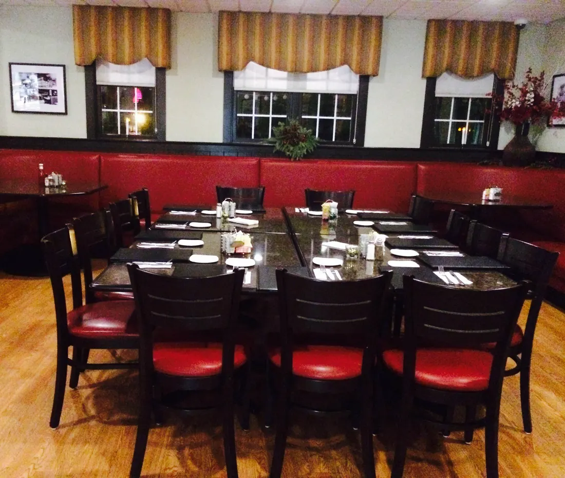 Fitzpatrick's red dining room set with long tables for a catered gathering
